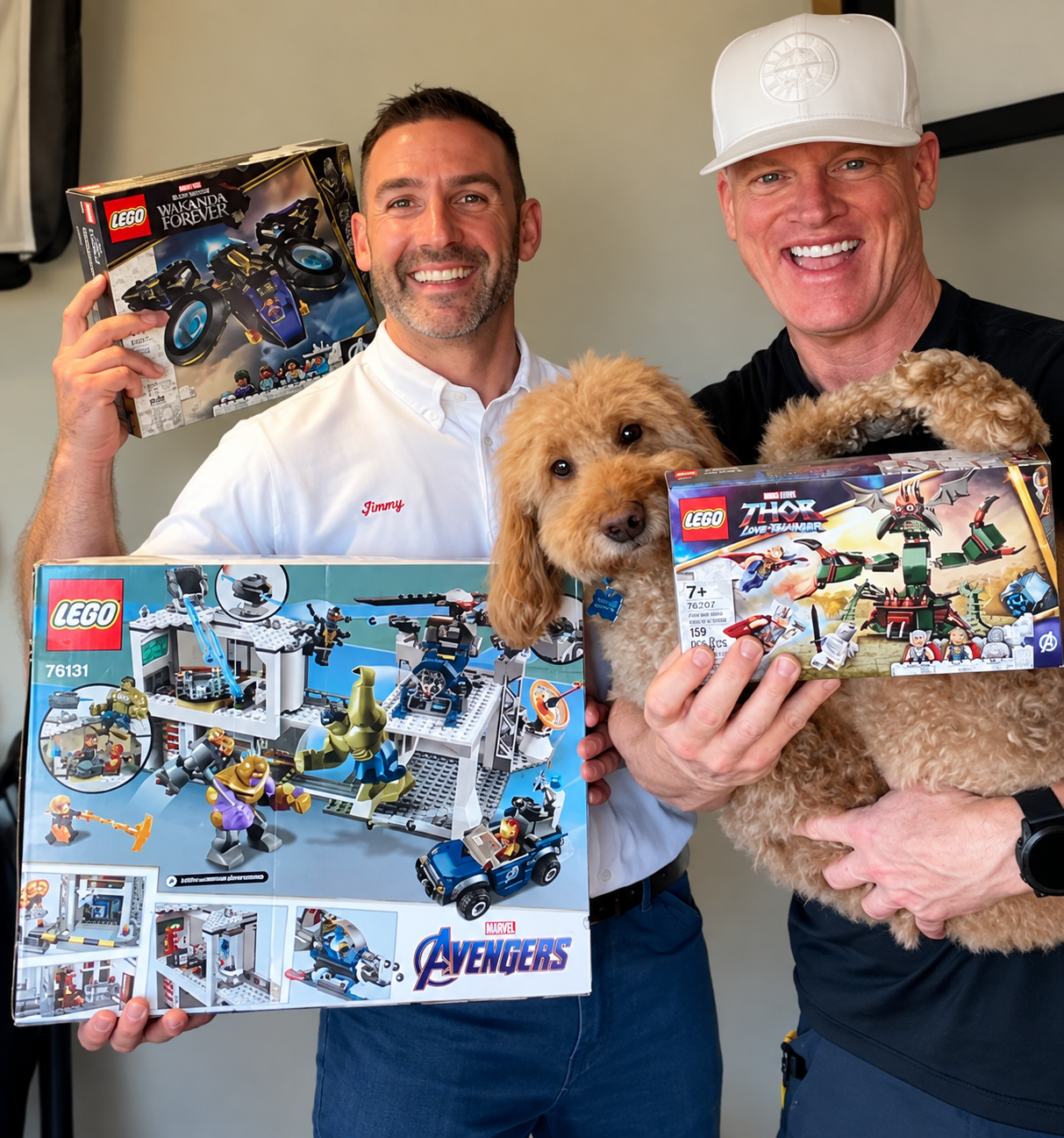 Don O’Neill with Charlie and Jimmy from Les Schwab, holding toys for a charity drive